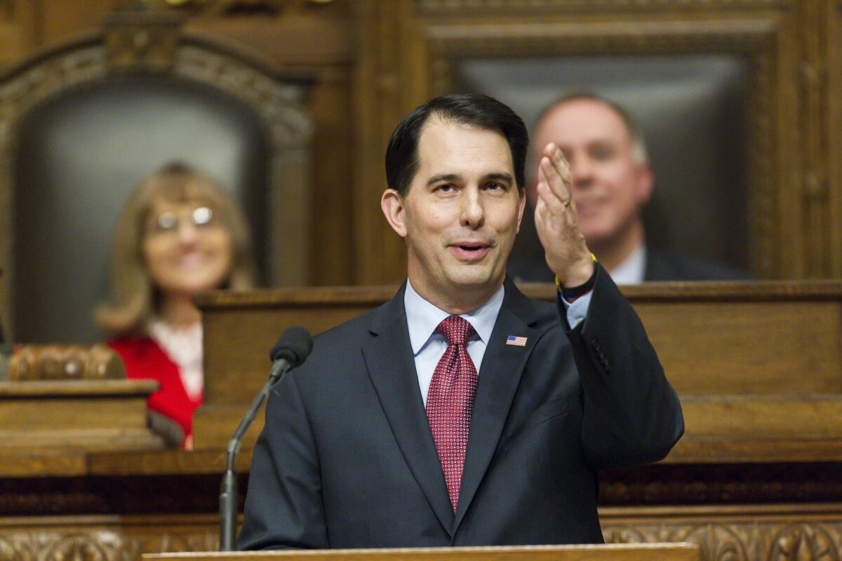 Wisconsin Gov. Scott Walker, seen last month delivering an address to the Legislature, strongly suggested in California on Thursday that a White House campaign is in his future.