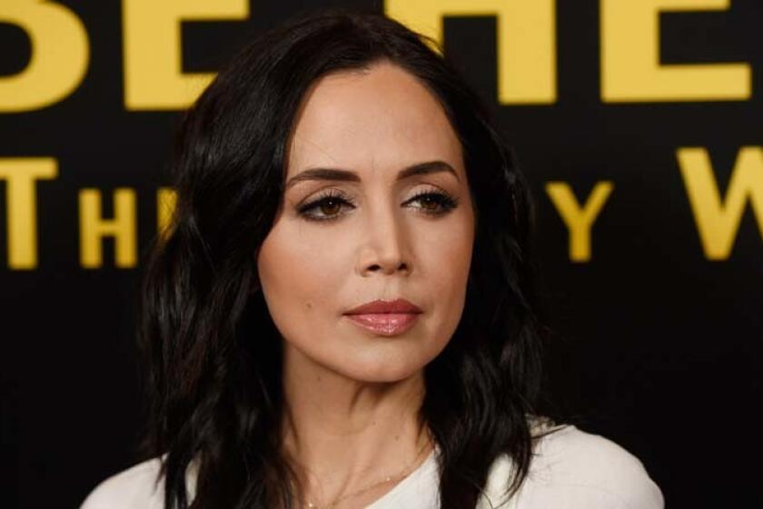 FILE - In this April 5, 2016 file photo, actress Eliza Dushku poses at the premiere of the film "Be Here Now (The Andy Whitfield Story)," at the UTA Theater in Beverly Hills, Calif. Dushku says she was sexually molested at age 12 by a stunt coordinator during production of the 1994 film "True Lies." In a post on her verified Facebook account Saturday, Jan. 13, 2018, Dushku also alleged that Joel Kramer, then 36, caused her to be injured on the set as payback for disclosing the alleged misconduct to a friend. (Photo by Chris Pizzello/Invision/AP, File)