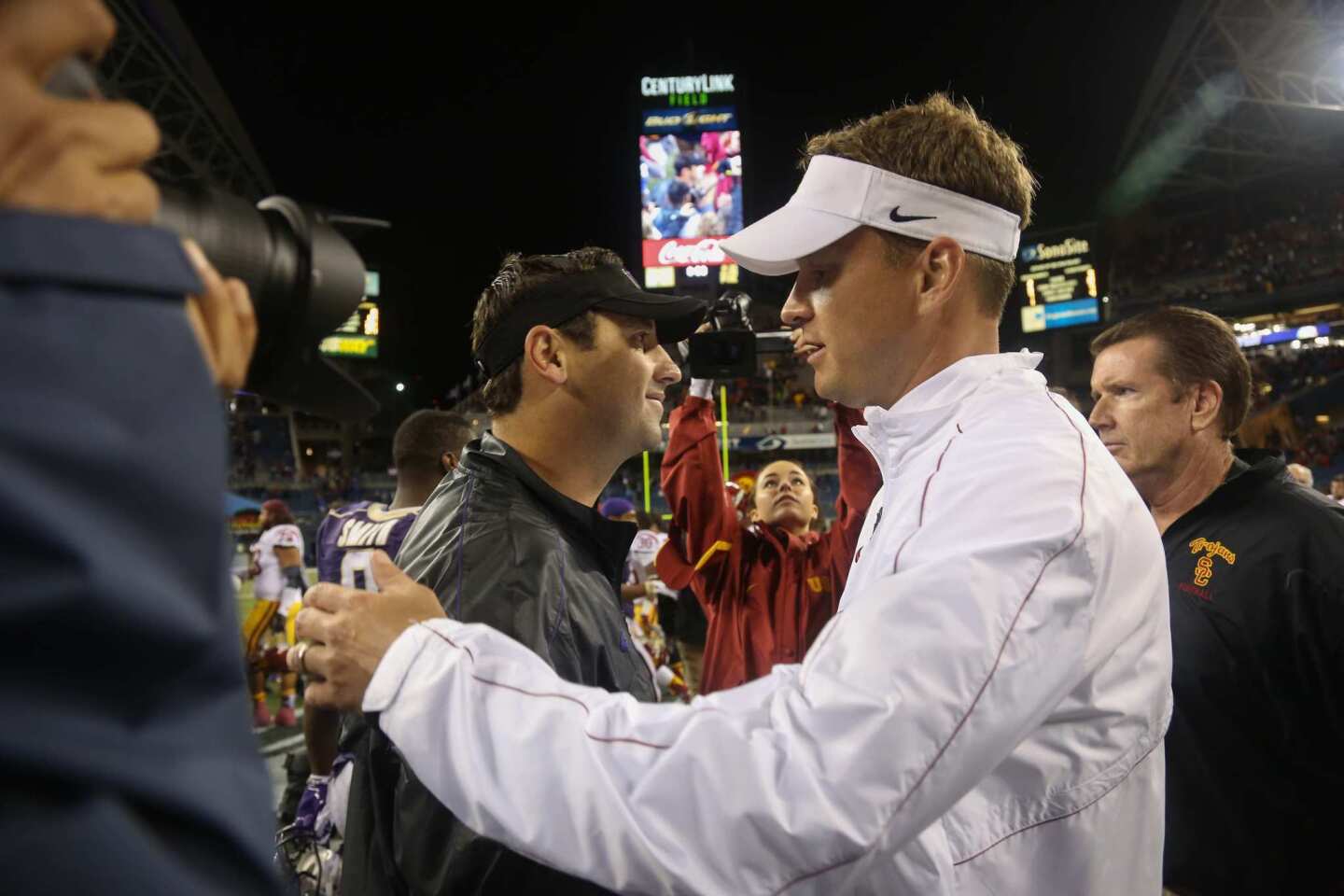 Washington coach Steve Sarkisian and USC's Lane Kiffin greet each other after the Trojans' 24-14 victory on Oct. 13, 2012.