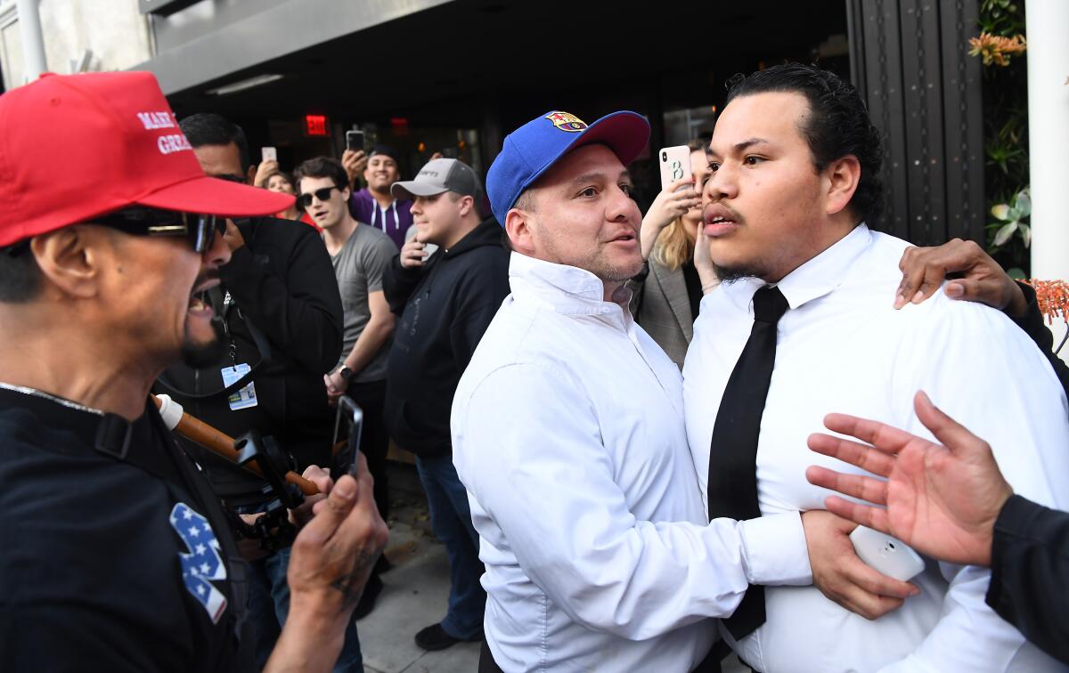 A confrontation between a protester and a Trump supporter outside the Montage Hotel in Beverly Hills