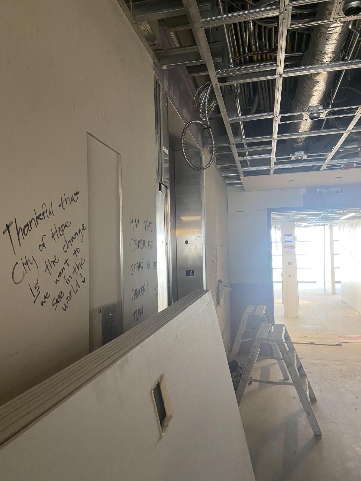 People have written messages on the walls of City of Hope's new cancer center.