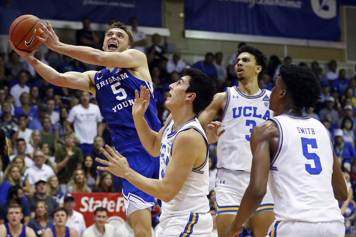 BYU guard Jake Toolson (5) shoots over the UCLA defense during the second half of an game Nov. 25 at the Maui Invitational in Lahaina, Hawaii.