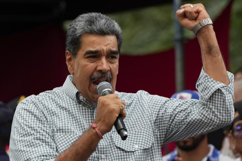 FILE - Venezuela's President Nicolas Maduro addresses government loyalists gathered at the presidential palace in support of his reelection one month after the presidential vote, in Caracas, Venezuela, Aug. 28, 2024. (AP Photo/Ariana Cubillos, File)