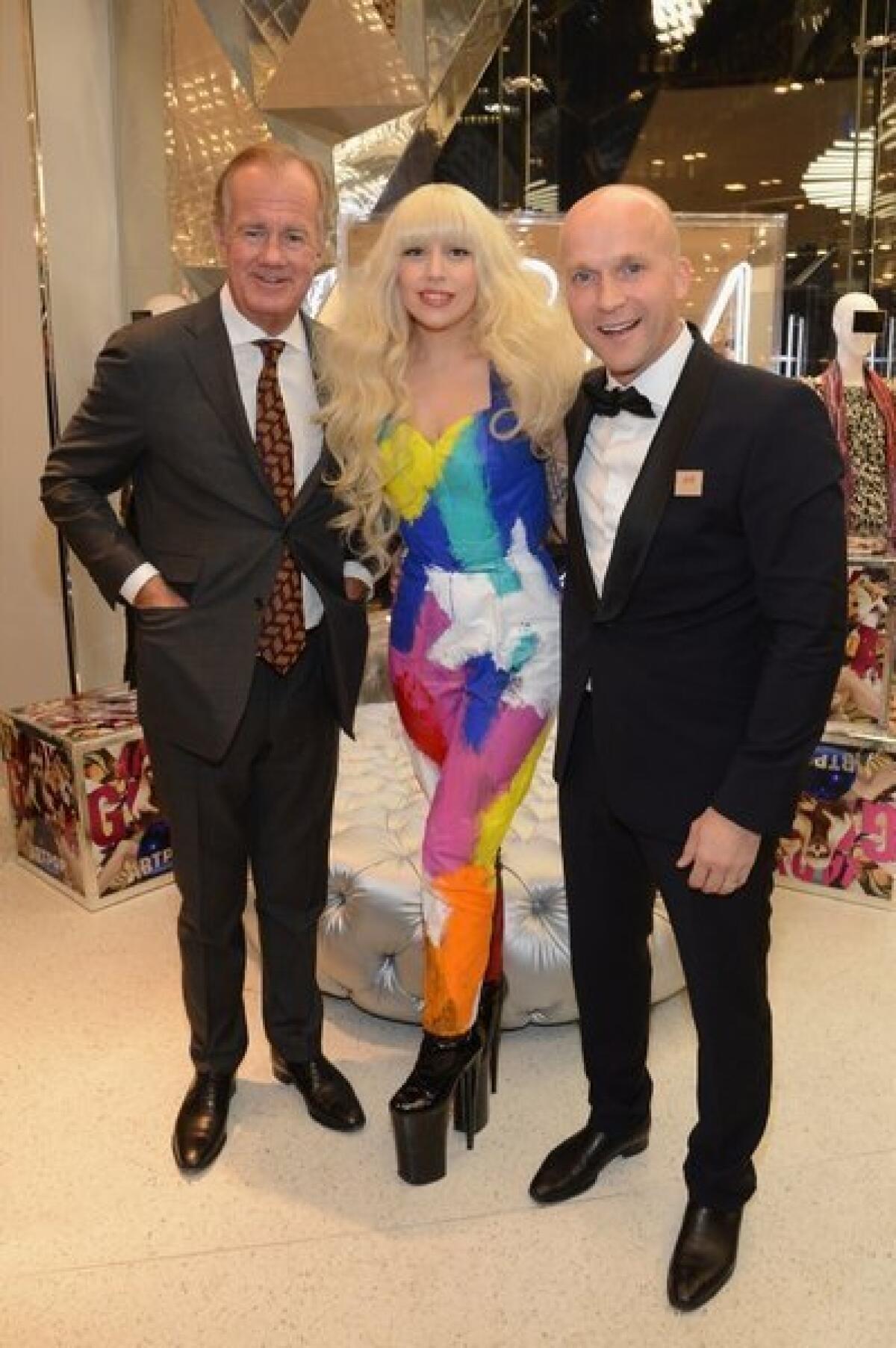 Lady Gaga joined H&M; executives Stefan Persson, left, and Daniel Kulle for the midnight opening of a new H&M; store in Times Square.