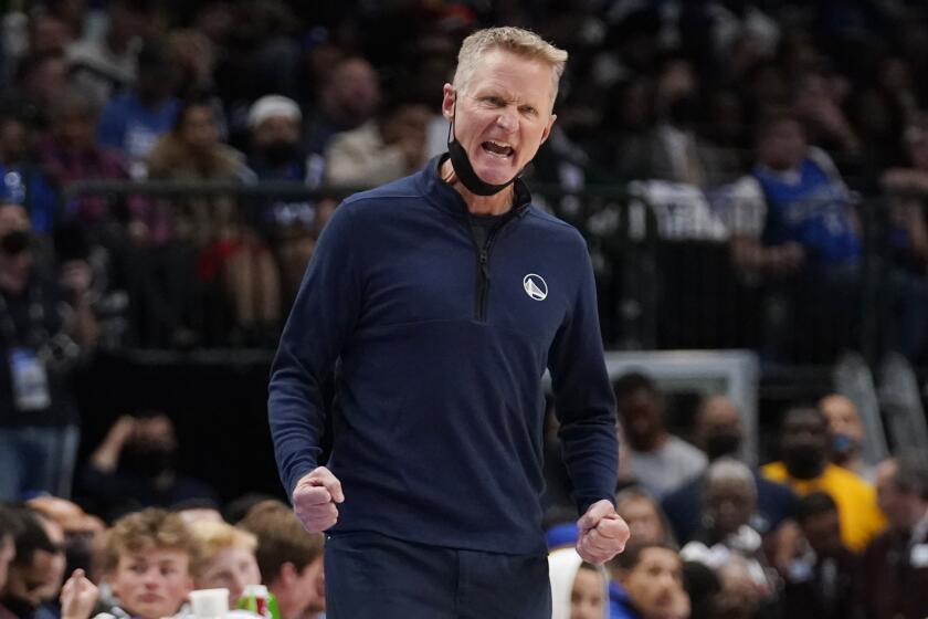 Golden State Warriors head coach Steve Kerr yells from the sideline