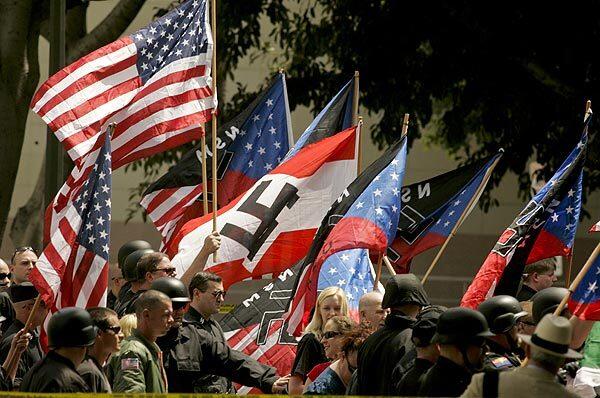 A group of about 40 National Socialist Movement members hold a rally outside Los Angeles City Hall.