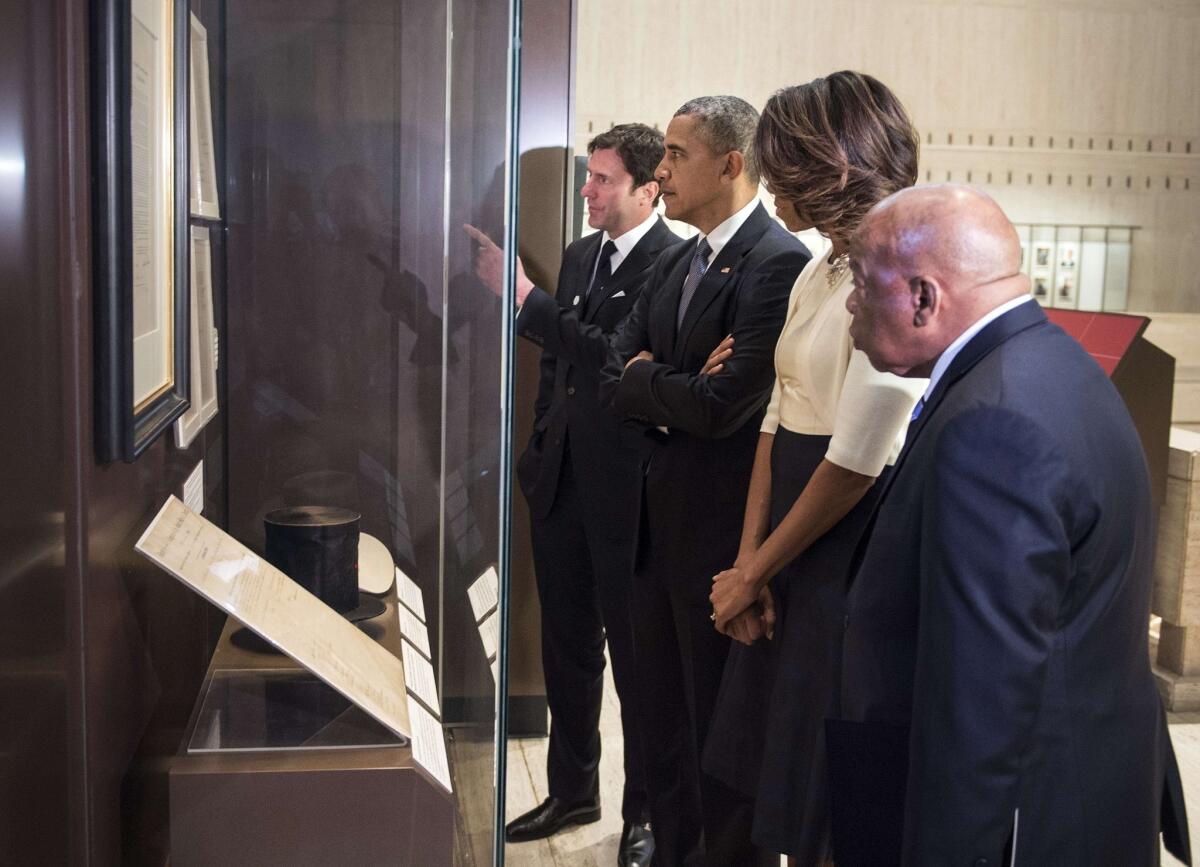 President Obama, First Lady Michelle Obama and Rep. John Lewis (D-Ga.) tour the Lyndon B. Johnson Presidential Library with Mark Updegrove, the director.