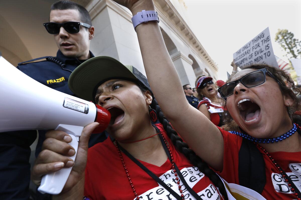 More than 1,500 people attend a May 1 rally on the steps of California's state Capitol in Sacramento demanding their civil liberties and the opening of the economy, closed due to the coronavirus.