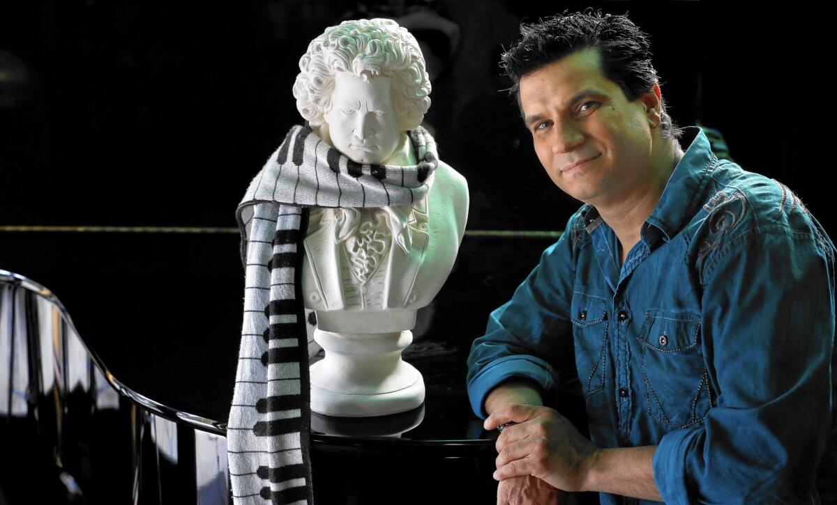 Video game composer Tommy Tallarico next to a bust of Beethoven at his home in San Juan Capistrano on May 5, 2015.