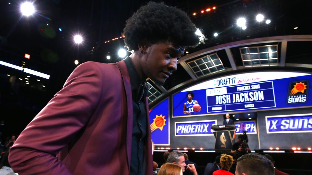 Josh Jackson walks to the stage after being drafted fourth overall by the Phoenix Suns.