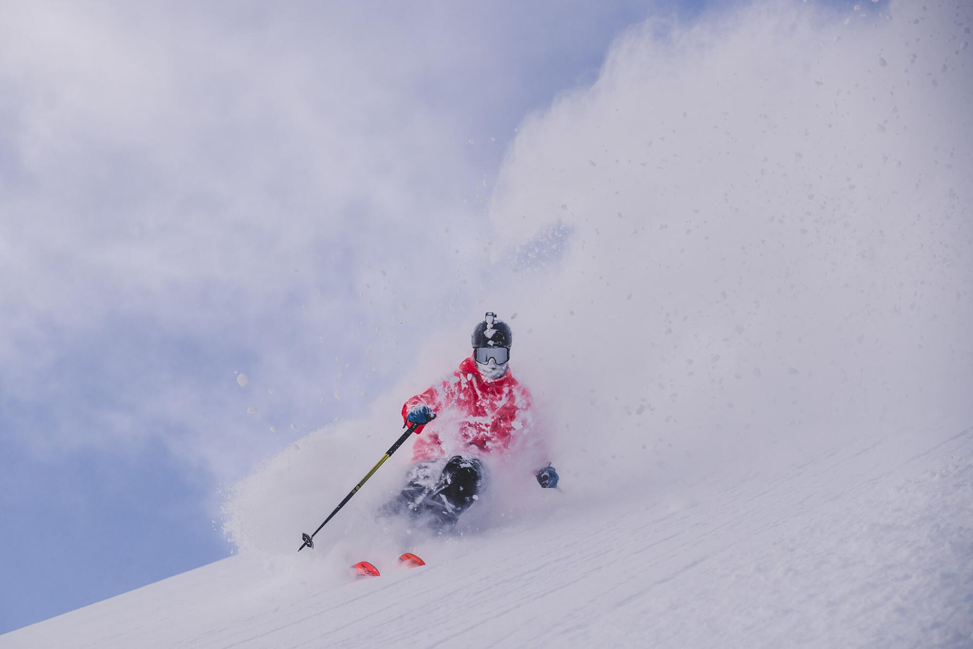 A person skies down a mountain