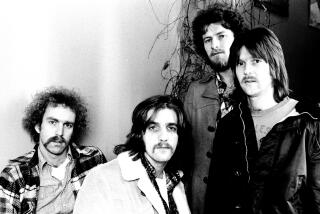 Bernie Leadon, Glenn Frey, Don Henley and Randy Meisner of The Eagles pose for a group portrait in London in 1973.