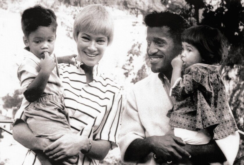 May Britt holds Mark and Sammy Davis Jr. cradles Tracey in a 1962 photo that is included in a new book.