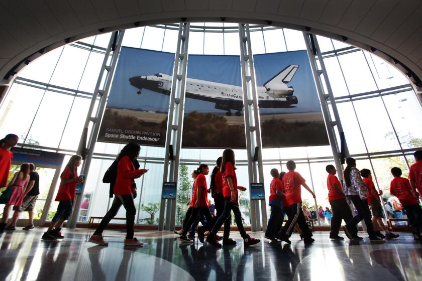 Visitors line up for access to the Samuel Oschin Pavilion to view the space shuttle Endeavour. As of March, more than 1 million people have visited the museum since the shuttle exhibit opened, a big jump from the 1.6 million visitors it usually sees annually.