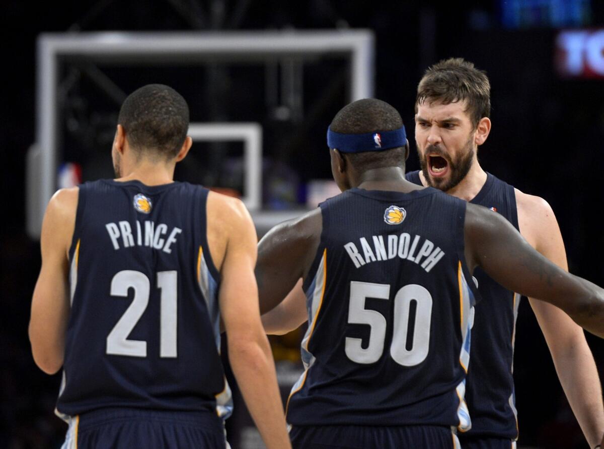 Memphis Grizzlies teammates Tayshaun Prince, left, Zach Randolph, center, and Marc Gasol celebrate a late basket during the team's win over the Lakers on Friday.