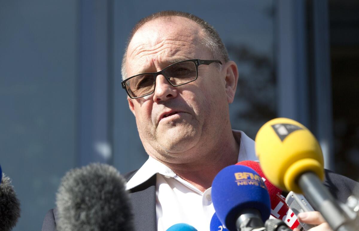 Britain's Chris Norman speaks with the media at the police headquarters in Arras, northern France, on Saturday after helping to subdue a gunman on a high-speed train traveling from Amsterdam to Paris on Friday.