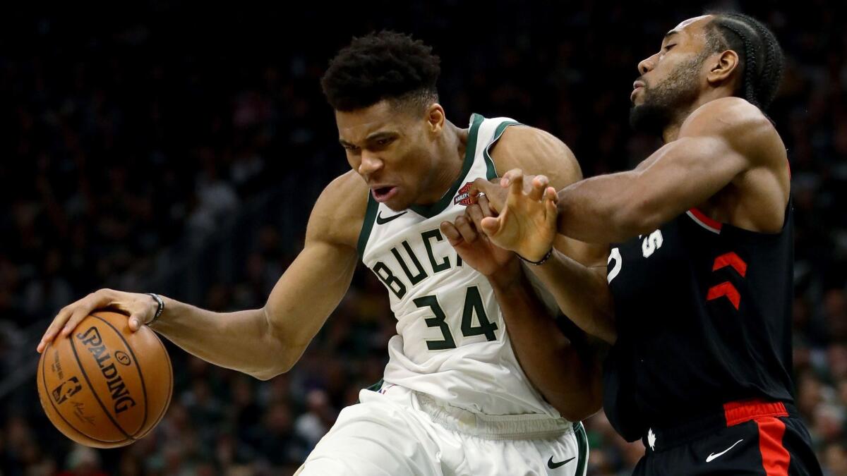 Milwaukee's Giannis Antetokounmpo tries to drive past Toronto's Kawhi Leonard during the Bucks' win in Game 2 of the Eastern Conference finals on May 17.