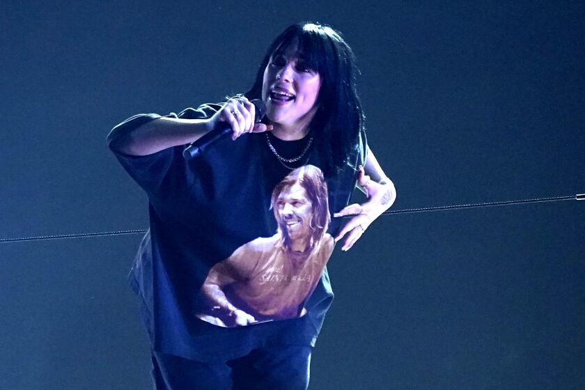 Late Taylor Hawkins appears on the shirt of Billie Eilish as she performs "Happier Than Ever" at the Grammy Awards