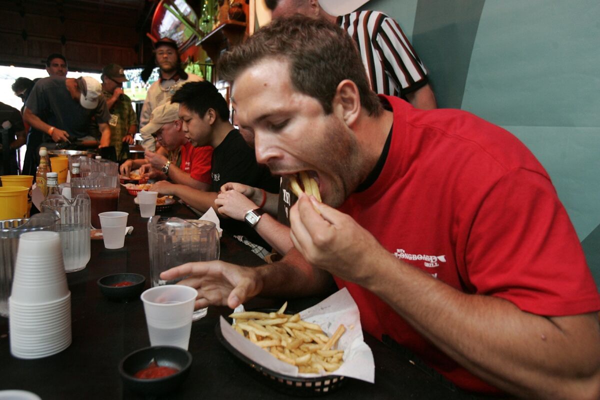 A french fry-eating contest at RT's Longboard Grill in Pacific Beach.