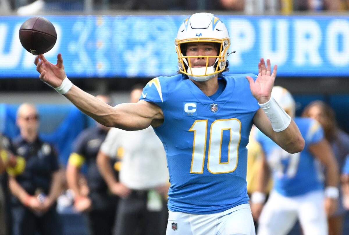 Chargers quarterback Justin Herbert throws a pass.