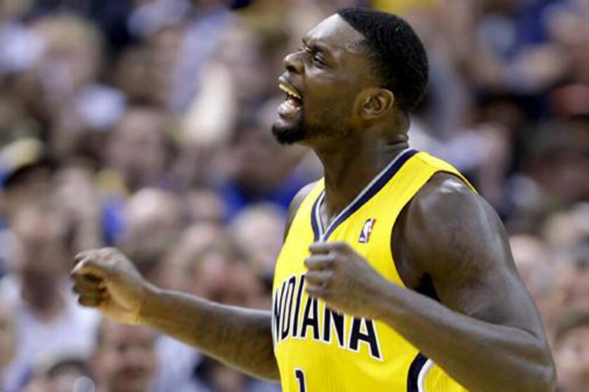 Lance Stephenson, then of the Indiana Pacers, celebrates after scoring in a 2014 game. The Clippers acquired Stephenson in a trade Monday with the Charlotte Hornets.
