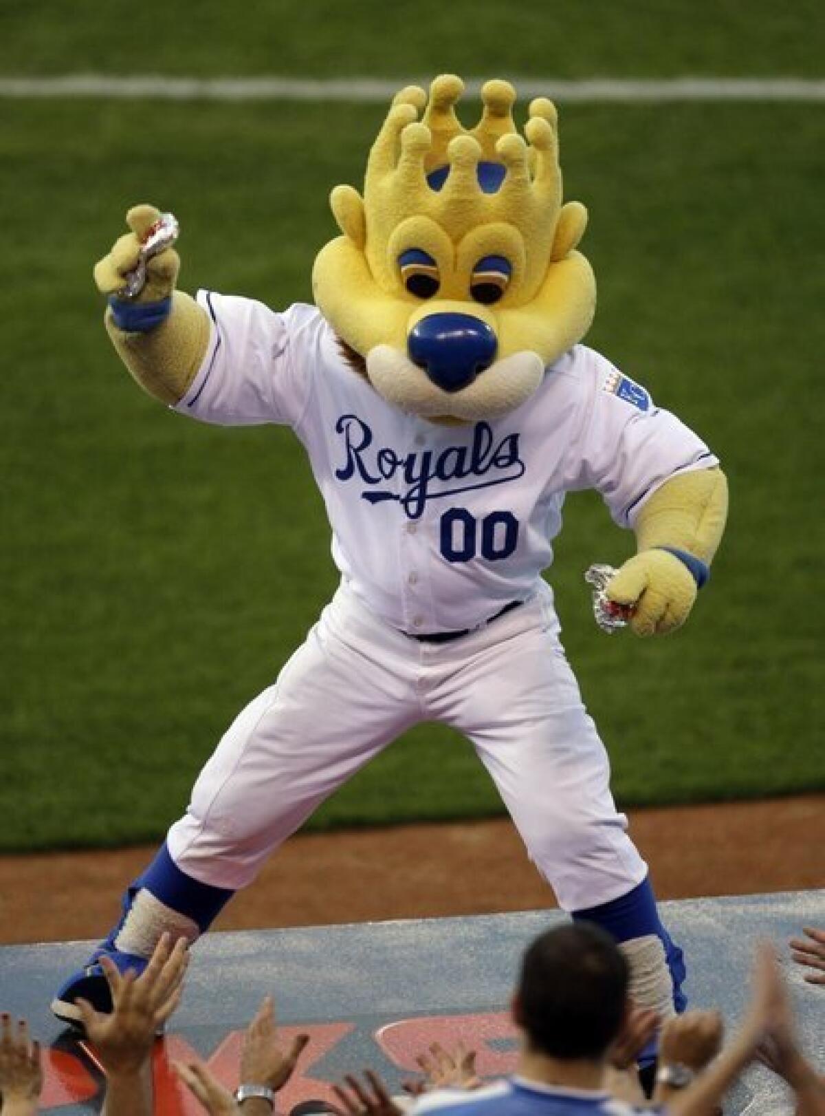 In 2009, Kansas City Royals mascot Sluggerrr throws hot dogs into the crowd. Watch out!