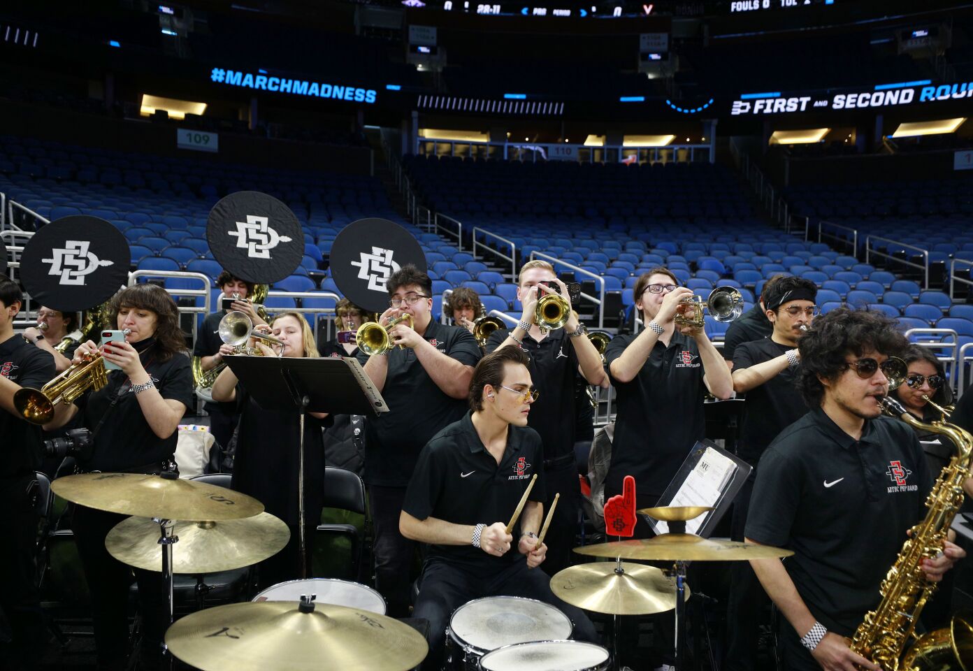 Orlando, FL - March 15: The Aztec Pep Band plays during San Diego State's practice ahead of the team's first round NCAA tournament game against the College of Charleston at the Amway Center in Orlando on Wednesday, March 15, 2023. (K.C. Alfred / The San Diego Union-Tribune)