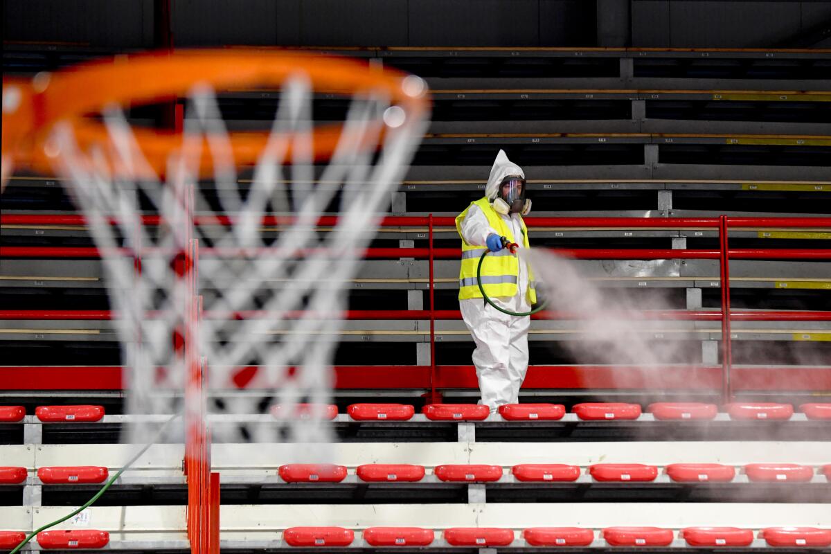 Operators of Naples Services sanitize the sports facility of Palabarbuto to counteract the danger of contagion from coronavirus, Naples, Italy on Tuesday. 