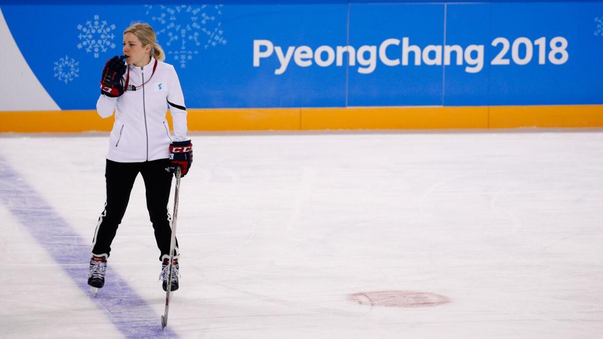 Sarah Murray, coach of the combined women's hockey team representing North and South Korea, watches her players train on Monday.