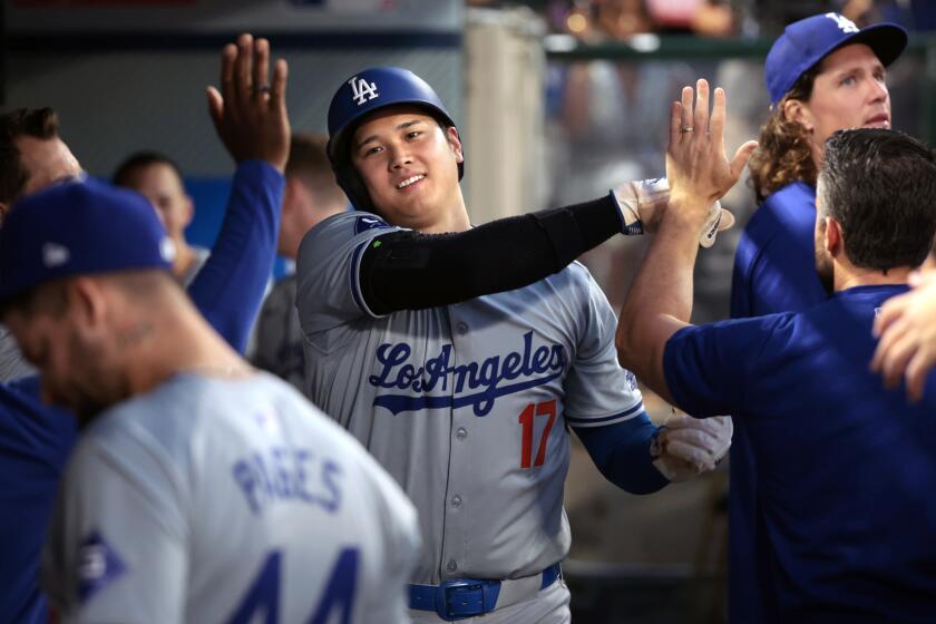 Anaheim, California September 3, 2024-Dodgers Shohei Ohtani celebrates after scoring a run against the Angels in the third inning at Anaheim Stadium Tuesday. (Wally Skalij/Los Angeles Times)