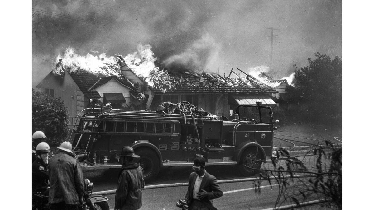 A house on Roscomare Road in Bel-Air burns in 1961.