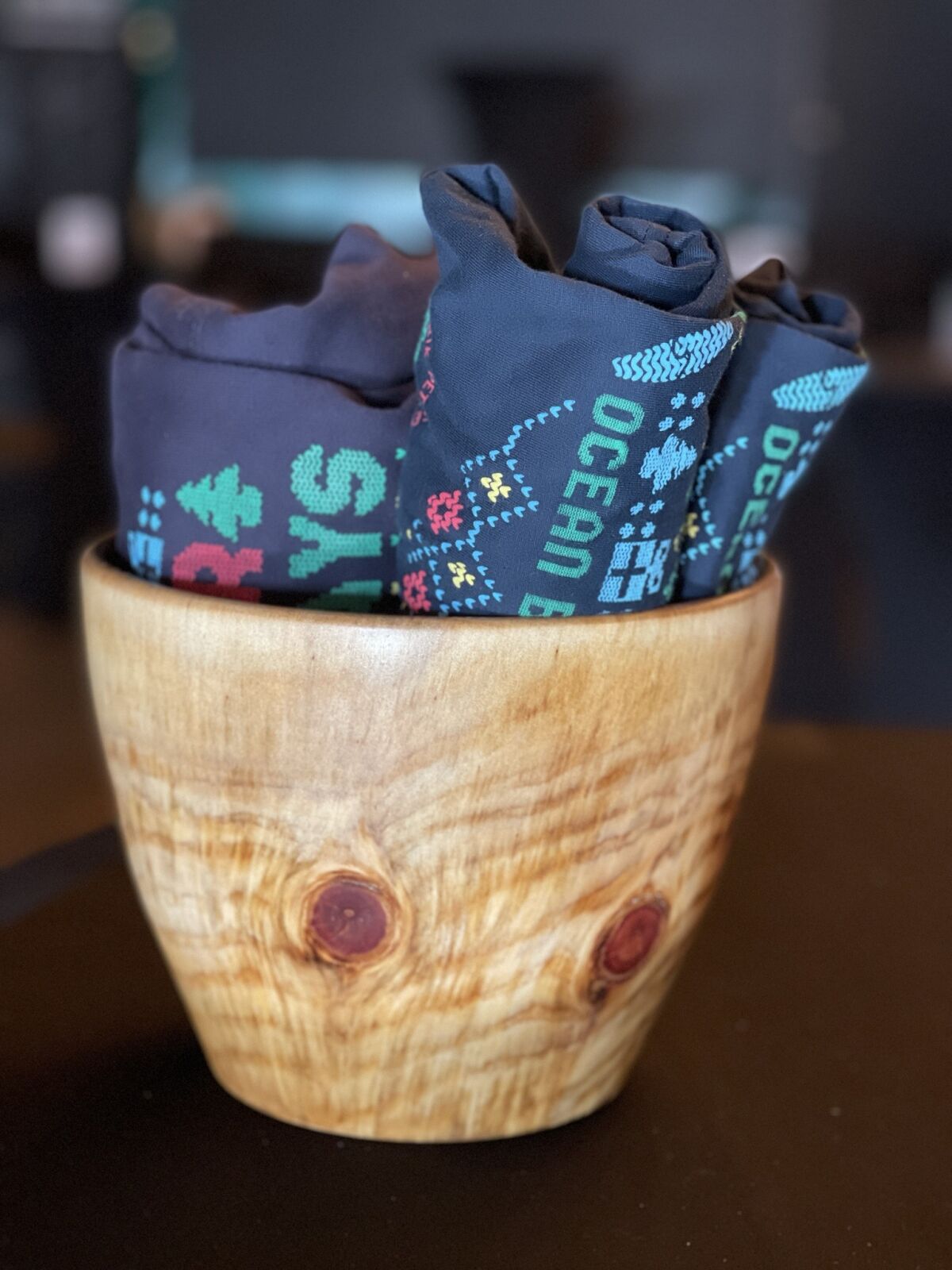 A bowl carved by Scott DeWarns was auctioned in a package with shirts at the Ocean Beach holiday auction in 2021.
