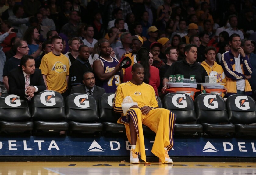 Lakers forward Antawn Jamison sits alone on the Lakers bench nursing an injured wrist.