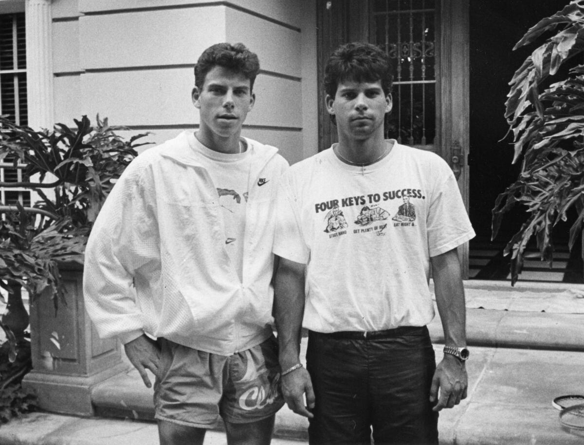 Erik Menendez, left, and his brother, Lyle, in front of their Beverly Hills home. 