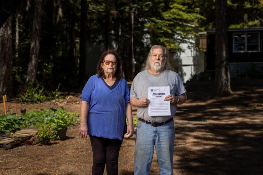 Corrine and Doug Thomas on their property in Miranda, a unincorporated community in Humboldt County.