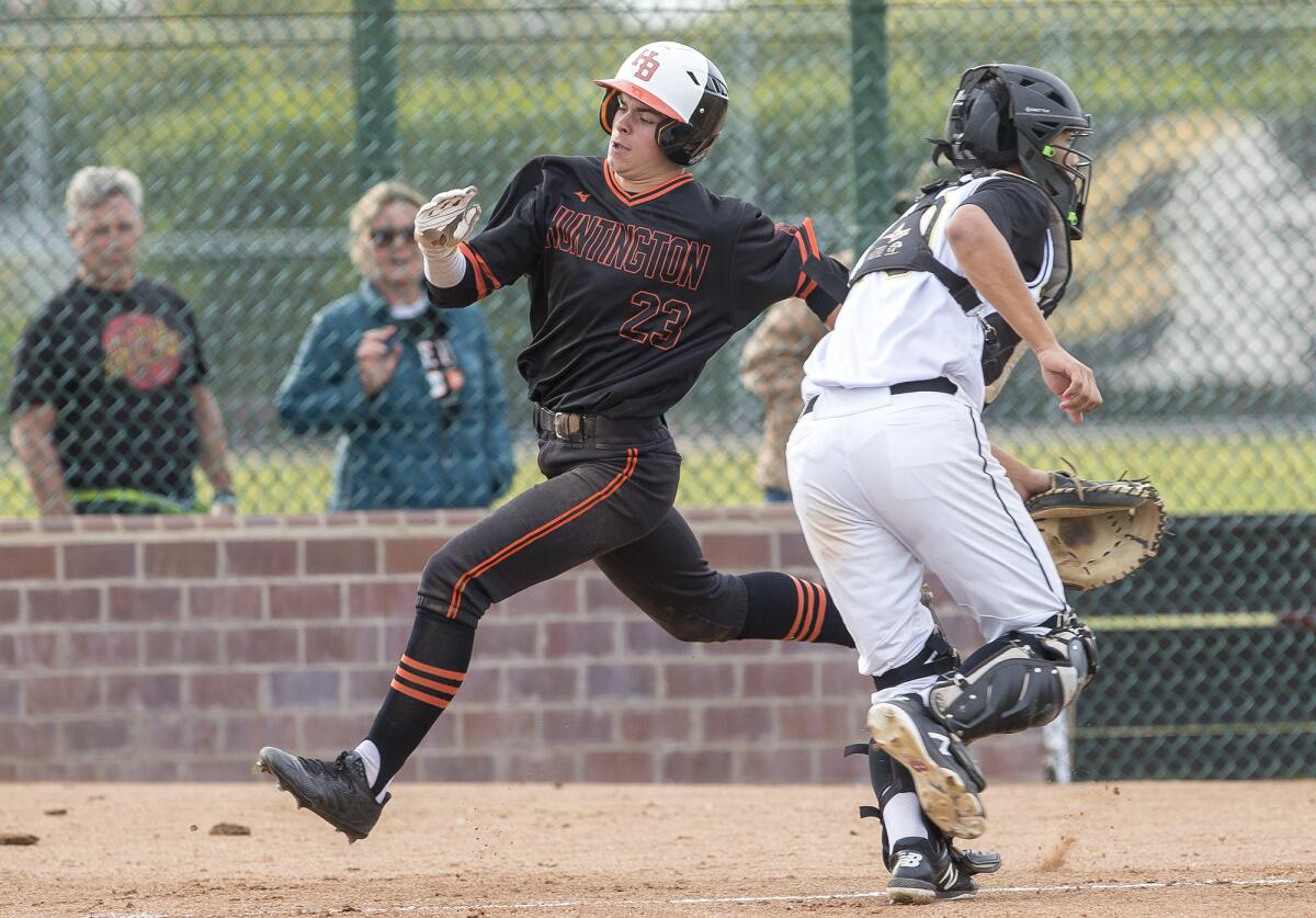 Huntington Beach's Nick Upstill scores on a triple by Nick Lopez in the sixth inning against Foothill during the Newport Elks Tournament Frank Lerner Division championship game on Friday, March 9.