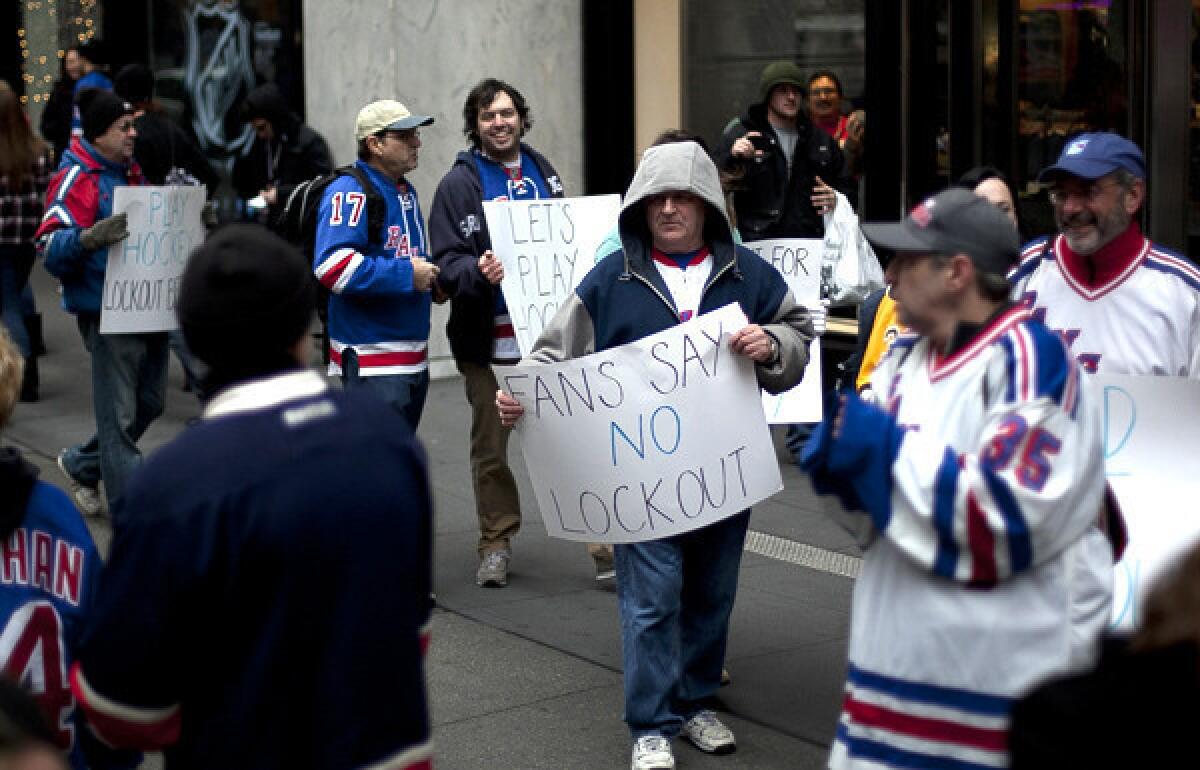 Hockey fans hold a protest outside the NHL offices in New York.