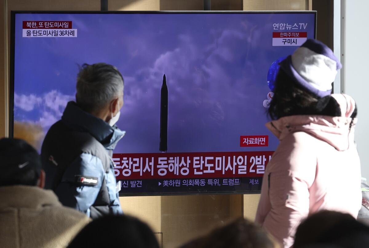 TV coverage of North Korea's missile launch is shown at the Seoul Railway Station on Sunday.