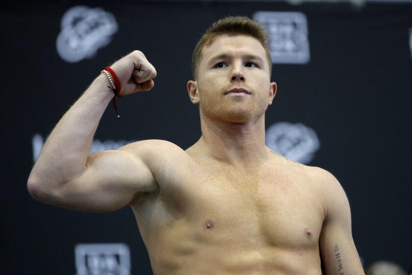 Canelo Alvarez stands on the scale during a weigh-in Friday, Nov. 1, 2019, in Las Vegas for his boxing bout against Sergey Kovalev for the WBO light heavyweight title Saturday. (AP Photo/John Locher)
