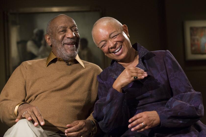 Bill Cosby and his wife, Camille, laugh Nov. 6 as they tell a story about collecting one of the pieces in an exhibit at the Smithsonian's National Museum of African Art in Washington.