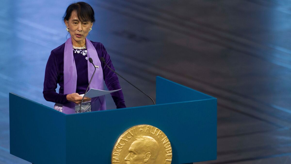In this June 16, 2012, file photo, Myanmar's Aung San Suu Kyi speaks during the Nobel Peace Prize lecture at the city hall in Oslo.
