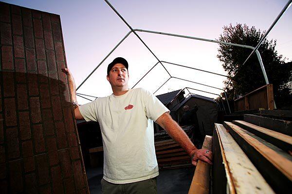 Kyle Killips was told to tear down his Simi Valley haunted house, and he did. But, after Simi residents flooded the city with complaints, officials did an about-face. Now, Killips is rebuilding in time to have the free home-based attraction up and running for Halloween weekend.