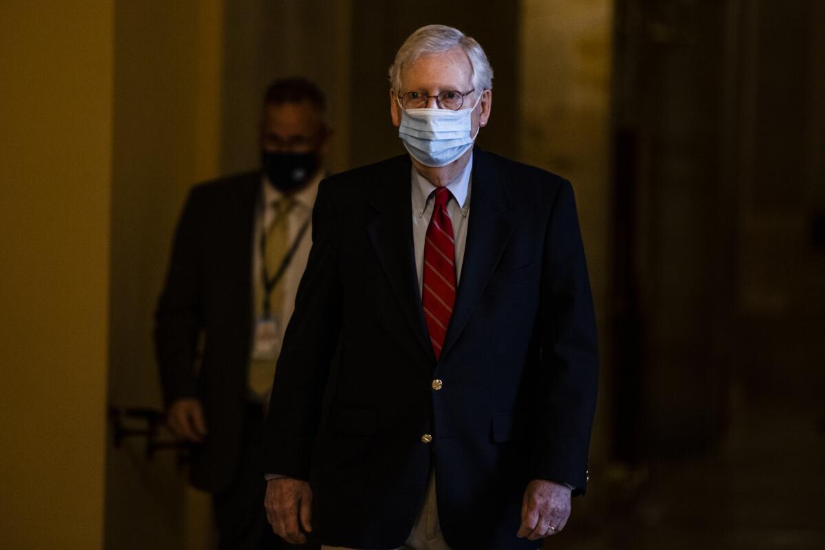 Senate Minority Leader Sen. Charles E. Schumer walks past reporters on Capitol Hill in Washington.