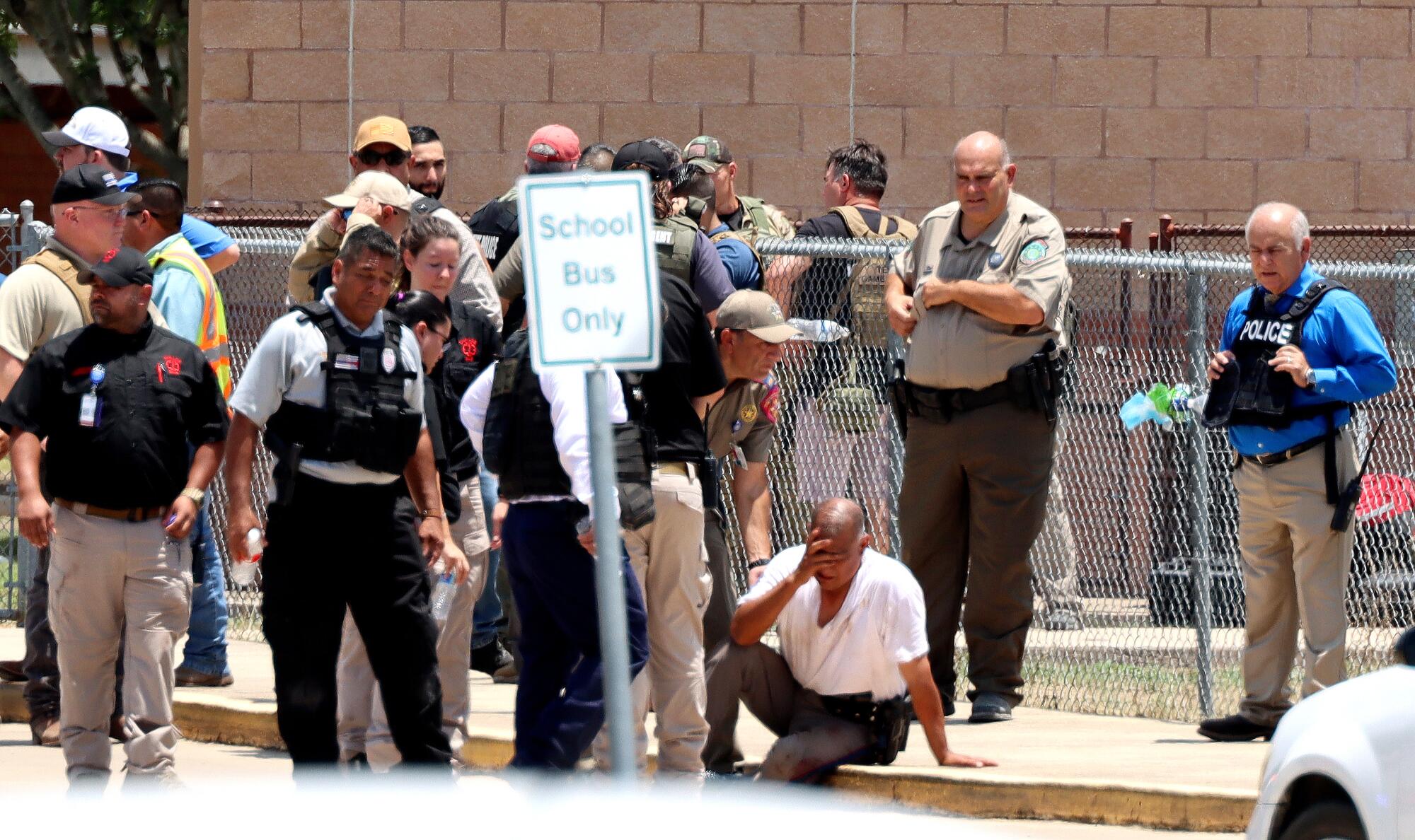 Police outside Robb Elementary School.