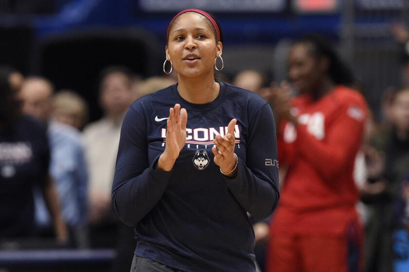 Former Connecticut player and Minnesota Lynx Maya Moore, is announced for a ceremony before a basketball game, Monday, Jan. 27, 2020, in Hartford, Conn. (AP Photo/Jessica Hill)