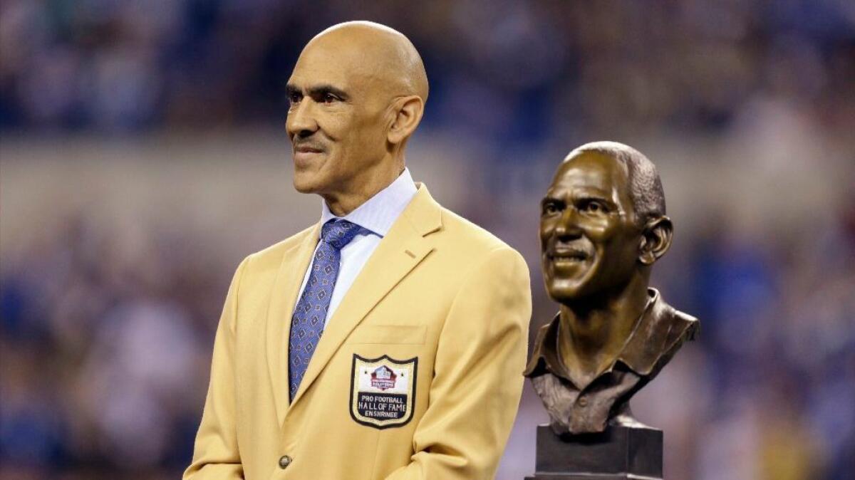 Hall of Fame Coach Tony Dungy, being honored during a ceremony in Indianapolis during a game between the Colts and the Pittsburgh Steelers on Nov. 24, is a strong proponent of the Rooney Rule.