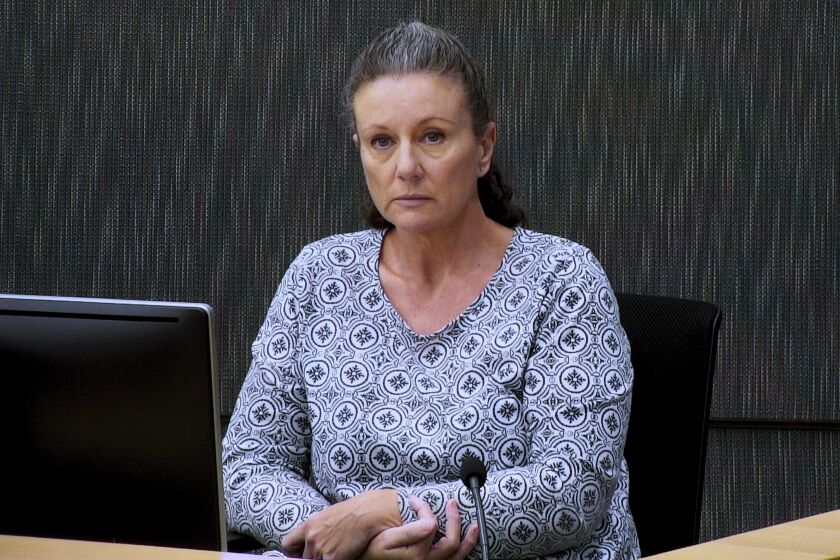 FILE - Kathleen Folbigg appears via video link during a convictions inquiry at the NSW Coroners Court, Sydney, Wednesday, May 1, 2019. New South Wales Attorney-General Michael Daley pardoned Folbigg on Monday, June 5, 2023, after spending 20 years in prison for killing her four children after being advised there was reasonable doubt about Folbigg's guilt based on new scientific evidence that the deaths could have been from natural causes.(Joel Carrett/AAP Image via AP, File)