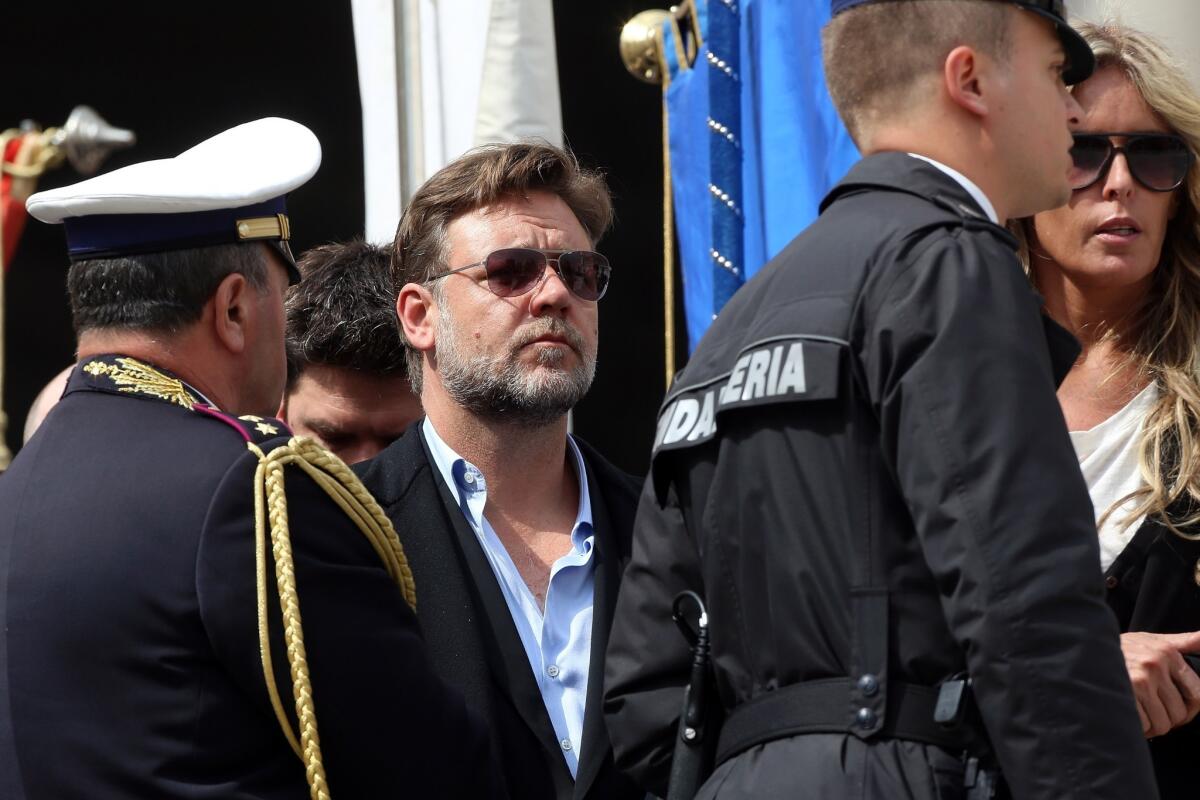 Russell Crowe, center, attends Pope Francis' weekly audience in St. Peter's Square.