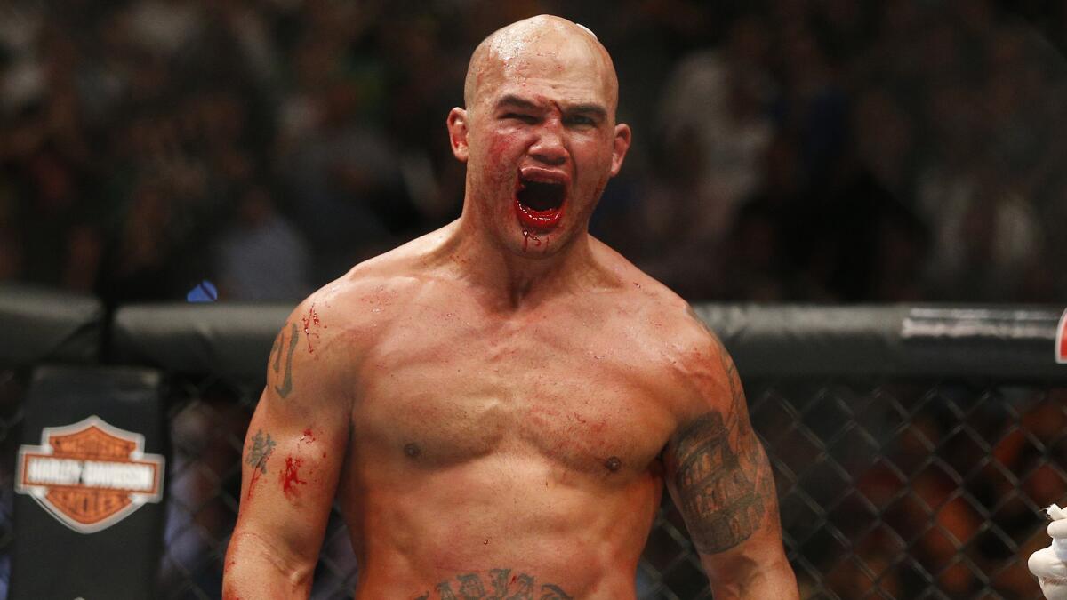 Robbie Lawler celebrates after defeating Rory MacDonald during their welterweight title fight at UFC 189 in Las Vegas on July 11.