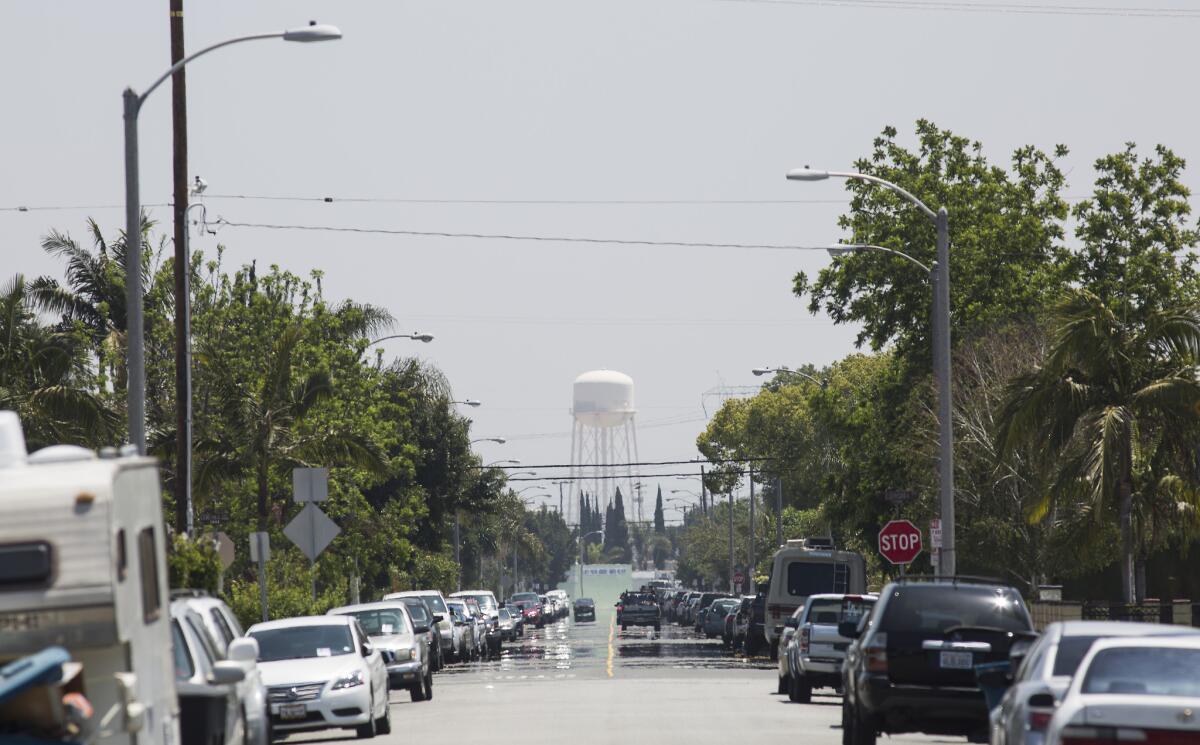 A tower in mostly industrial Vernon looms over a leafy neighborhood in Maywood.